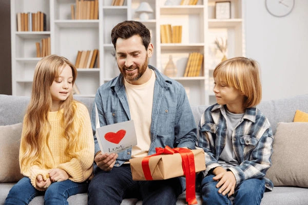 dad with gifts from children